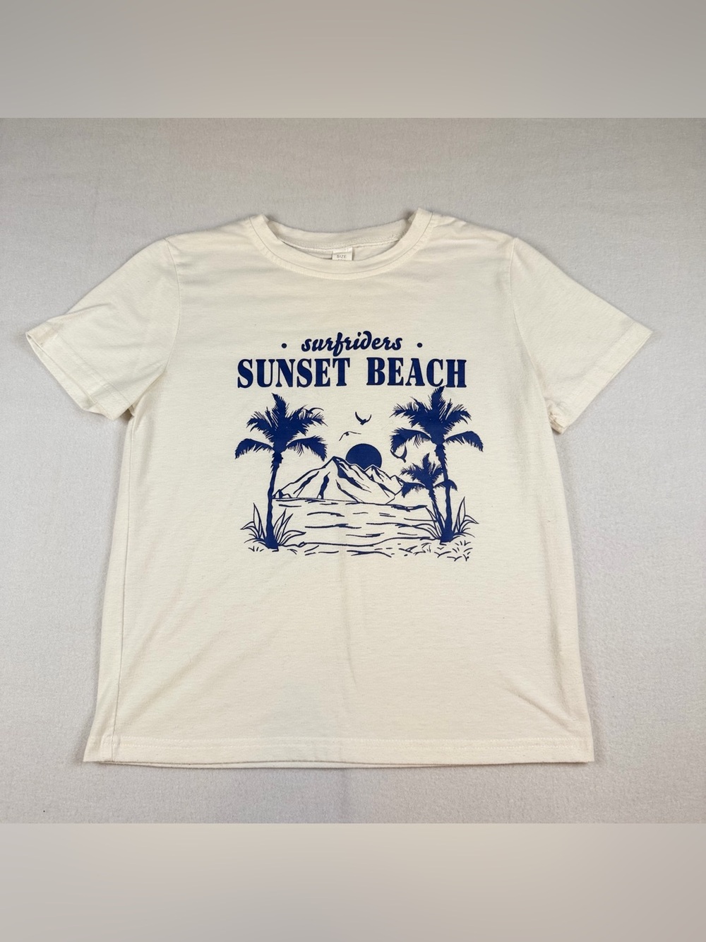 Riders by Lee Cream Tee with Navy Sunset Beach Graphic